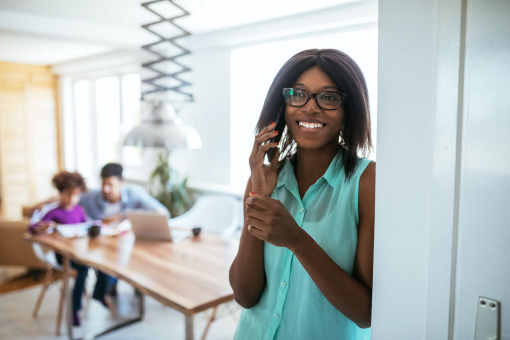 interviewee smiling talking on phone