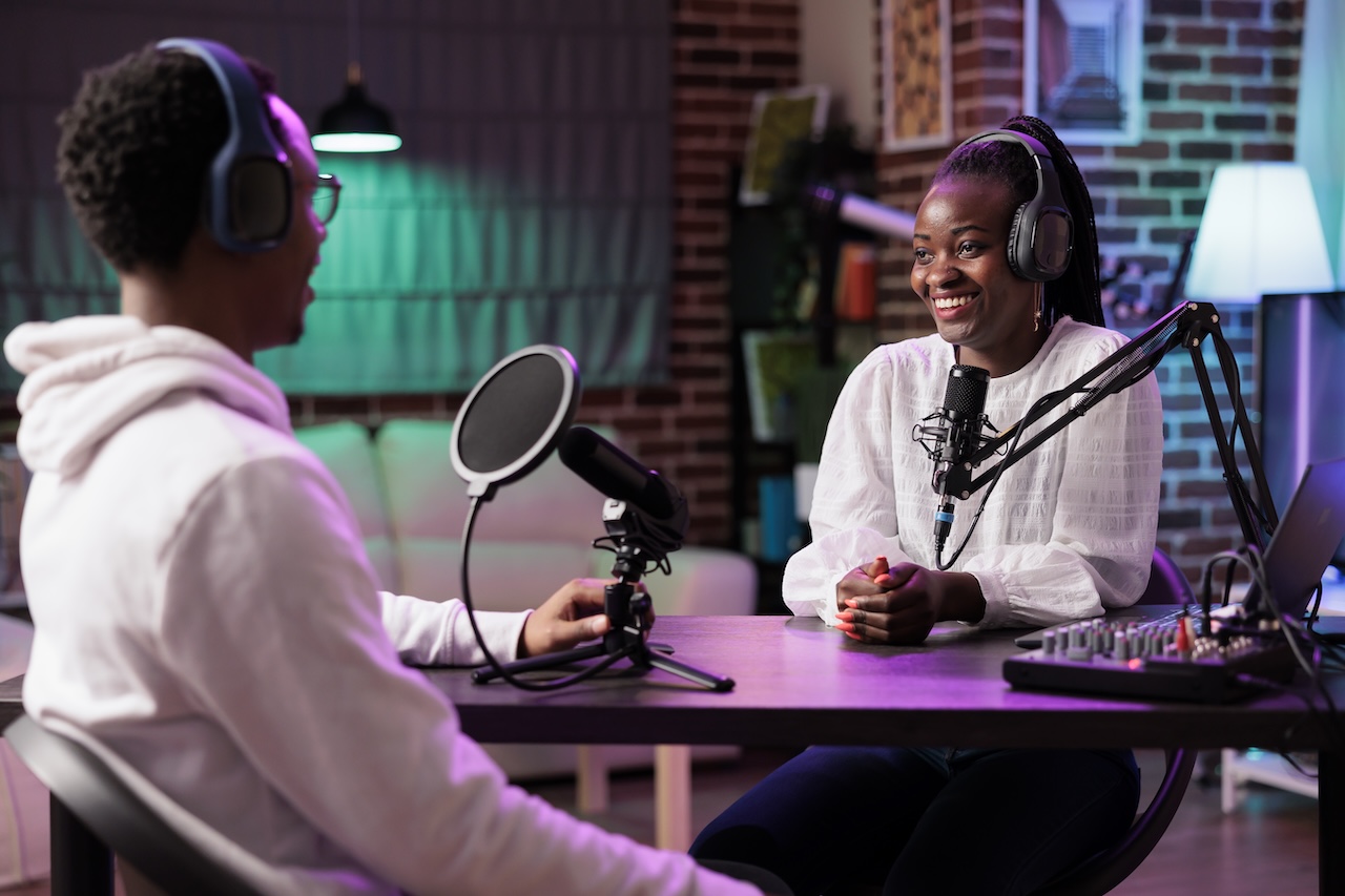 podcast host interviewing guest in studio